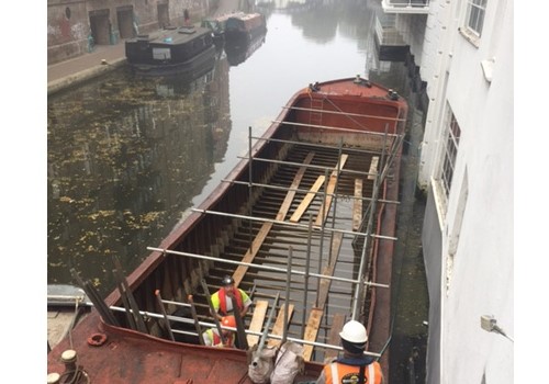 Sunken barge provides scaffolding solution for canalside offices